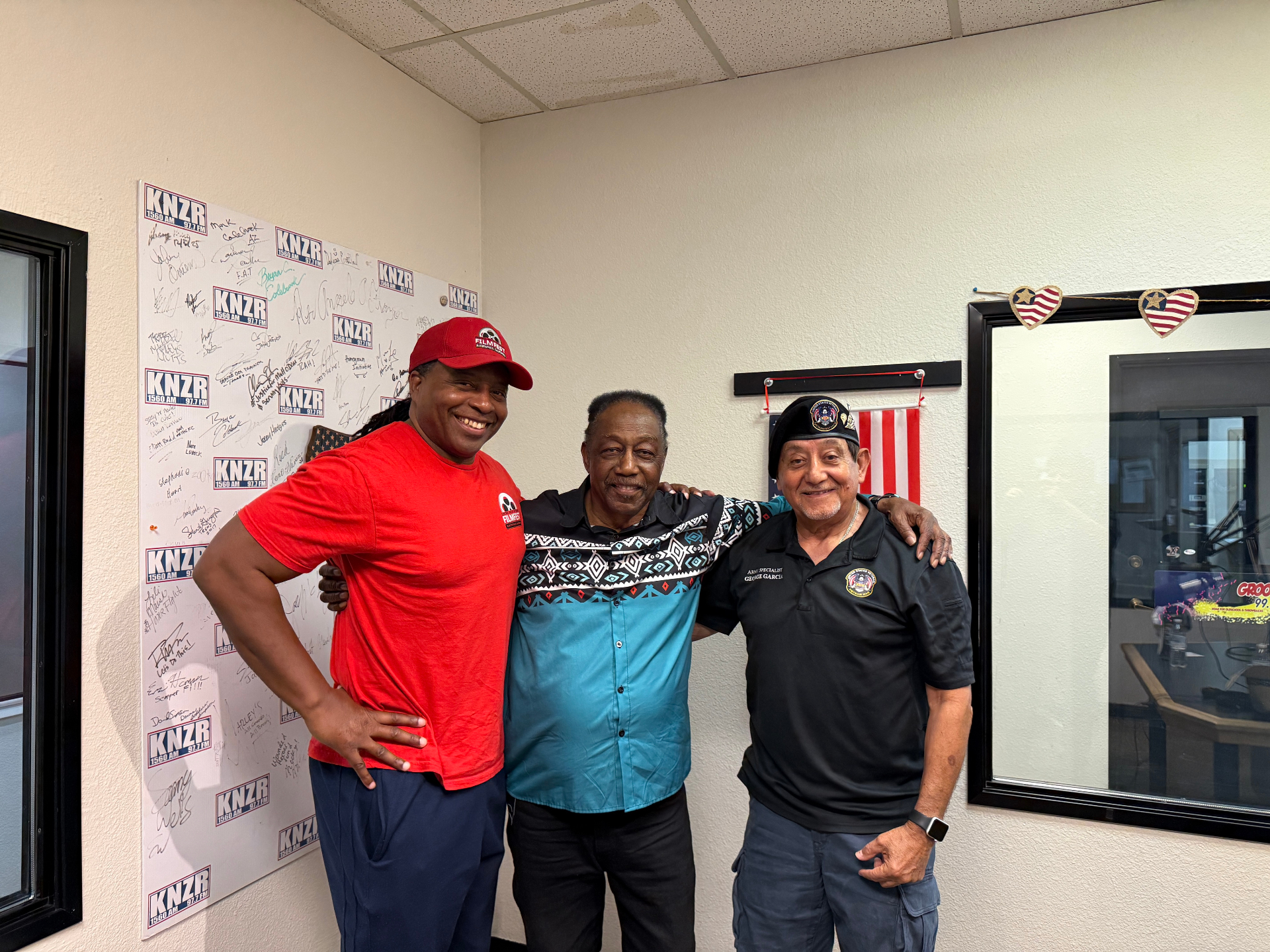Julian Wilson of Silver Titan Productions, Tony Lee, and Vietnam veteran George Garcia in the KNZR studio